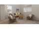 Bright living room with neutral decor and two large windows at 1936 Alpine Dr, Erie, CO 80516
