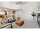 Spacious living area with fireplace, tall ceilings, and seamless transition to the kitchen at 1936 Alpine Dr, Erie, CO 80516
