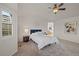 Inviting main bedroom features vaulted ceiling, neutral carpet, and ensuite bathroom at 1936 Alpine Dr, Erie, CO 80516