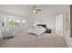 Spacious main bedroom boasts a vaulted ceiling, bay window, and neutral carpet at 1936 Alpine Dr, Erie, CO 80516
