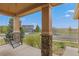 Inviting front porch featuring a hanging swing and scenic neighborhood views at 1936 Alpine Dr, Erie, CO 80516