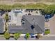 Aerial view showcasing pool, lounge chairs, fireplace, and parking at 3865 S Dayton St # 105, Aurora, CO 80014