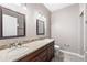 Elegant bathroom featuring a double vanity, granite countertop, and tiled floors for a luxurious feel at 3865 S Dayton St # 105, Aurora, CO 80014