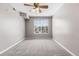 Cozy bedroom with carpet, complemented by a ceiling fan and natural light at 3865 S Dayton St # 105, Aurora, CO 80014