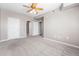 Carpeted bedroom with ceiling fan, offering a comfortable living space at 3865 S Dayton St # 105, Aurora, CO 80014