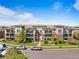 Building exterior featuring balconies and well-maintained landscaping at 3865 S Dayton St # 105, Aurora, CO 80014