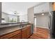 Modern kitchen featuring a stainless steel dishwasher and sink looking into the living room at 3865 S Dayton St # 105, Aurora, CO 80014