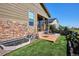 Backyard featuring a patio area with outdoor seating and well-maintained lawn at 2012 Sagerock Dr, Castle Pines, CO 80108