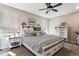 Calming bedroom with ceiling fan, neutral tones, and ample natural light at 2012 Sagerock Dr, Castle Pines, CO 80108