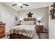 Tranquil bedroom featuring rustic decor, soft lighting, and a ceiling fan at 2012 Sagerock Dr, Castle Pines, CO 80108