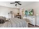 Comfortable bedroom featuring modern decor and a ceiling fan at 2012 Sagerock Dr, Castle Pines, CO 80108