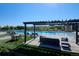 Resort-style pool and lounge area surrounded by lush landscaping, ideal for relaxation and social gatherings at 2012 Sagerock Dr, Castle Pines, CO 80108