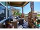 Inviting covered porch with comfortable seating and stylish decor at 2012 Sagerock Dr, Castle Pines, CO 80108