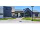 Attractive building exterior with stone accents, covered entrance, and well-maintained landscaping at 2012 Sagerock Dr, Castle Pines, CO 80108