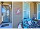 Cozy front porch with a welcoming sign, comfortable bench, and stylish decor creating a warm atmosphere at 2012 Sagerock Dr, Castle Pines, CO 80108