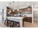 Modern kitchen with a center island, bar stool seating, stainless steel appliances, and ample counter space at 2012 Sagerock Dr, Castle Pines, CO 80108