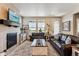 Inviting living room with leather sofas, area rug and fireplace at 2012 Sagerock Dr, Castle Pines, CO 80108