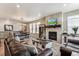 Open-concept living room and dining area with modern decor and natural light at 2012 Sagerock Dr, Castle Pines, CO 80108