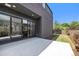 Modern backyard offers a seamless transition to the indoors with large sliding glass doors at 3057 S University Cir, Englewood, CO 80113