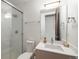 Bathroom with modern fixtures, glass shower, and vanity with ample counter space at 3057 S University Cir, Englewood, CO 80113