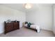 bedroom featuring a cozy bed, dresser, and neutral carpet at 3057 S University Cir, Englewood, CO 80113