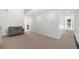 Spacious living room featuring neutral carpet, bright white walls and a comfortable sofa at 3057 S University Cir, Englewood, CO 80113