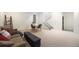 Cozy living room features a couch, dining table, and stairs leading to the upper level at 3057 S University Cir, Englewood, CO 80113