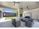 Charming patio features an outdoor fireplace and a comfortable swing perfect for relaxation at 3057 S University Cir, Englewood, CO 80113
