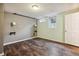 Unfinished basement area with dark wood flooring and potential for customization as a recreation or storage space at 1456 Wabash St, Denver, CO 80220