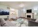 Finished basement offering bar, fireplace, living area, and ample space at 1456 Wabash St, Denver, CO 80220