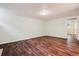 Unfinished basement featuring dark wood flooring and neutral-toned walls creating a versatile and adaptable area at 1456 Wabash St, Denver, CO 80220