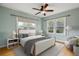 Inviting bedroom with light colored walls, wood floors, and natural light at 1456 Wabash St, Denver, CO 80220