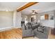 Bright living room featuring hardwood floors, ceiling fan, and neutral décor at 1456 Wabash St, Denver, CO 80220