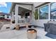 Relaxing back patio with a modern fire pit and partially covered space at 1256 Elbridge Dr, Elizabeth, CO 80107