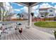 Charming back patio with bistro set overlooking a beautifully landscaped backyard and neighboring houses at 1256 Elbridge Dr, Elizabeth, CO 80107