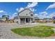 Beautiful backyard featuring a covered porch and gravel landscaping and verdant lawn at 1256 Elbridge Dr, Elizabeth, CO 80107