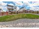 Lush backyard with green grass and decorative rocks, complemented by a sturdy wooden fence at 1256 Elbridge Dr, Elizabeth, CO 80107
