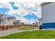 Spacious backyard showcasing gravel, grass, fence, and nearby homes for a serene outdoor experience at 1256 Elbridge Dr, Elizabeth, CO 80107
