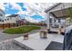 Backyard showing firepit area with a grassy area and a stained wood fence at 1256 Elbridge Dr, Elizabeth, CO 80107