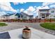 Wide angle backyard view with a concrete patio and view of the neighborhood at 1256 Elbridge Dr, Elizabeth, CO 80107