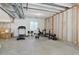 Spacious unfinished basement with exercise equipment and exposed ceiling at 1256 Elbridge Dr, Elizabeth, CO 80107