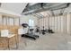 Unfinished basement area equipped with exercise equipment and two barstools at 1256 Elbridge Dr, Elizabeth, CO 80107