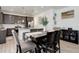 Stylish dining room with modern lighting, wood floors, and an open layout to the kitchen area at 1256 Elbridge Dr, Elizabeth, CO 80107