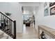 Hallway view showcasing the home's hardwood floors leading to the living room at 1256 Elbridge Dr, Elizabeth, CO 80107
