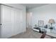 Hallway features a large closet, neutral walls, and neutral carpeting at 1256 Elbridge Dr, Elizabeth, CO 80107