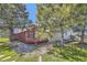 Relaxing backyard features a wooden deck, seating area, and a well-maintained lawn at 11014 Callaway Rd, Parker, CO 80138
