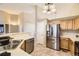 Well-lit kitchen featuring stainless steel appliances and a double sink at 11014 Callaway Rd, Parker, CO 80138