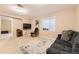 Inviting living room boasts a comfortable couch, a mounted TV, and a stylish rug at 11014 Callaway Rd, Parker, CO 80138