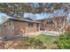 Spacious backyard features lush grass and a charming brick home at 2065 Depew St, Edgewater, CO 80214