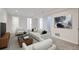 Spacious finished basement with modern decor, ample seating, and plenty of natural light at 2065 Depew St, Edgewater, CO 80214